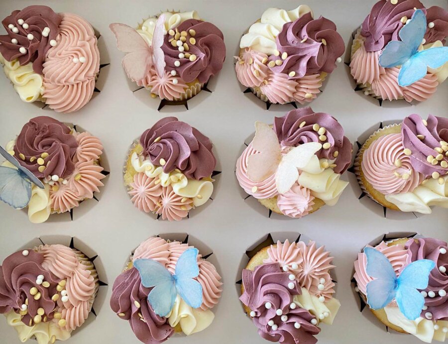 Pink and purple cupcakes with butterflies.
