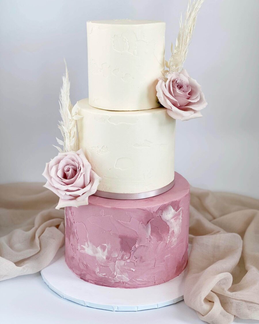 Soft pink and ivory baby shower cake.